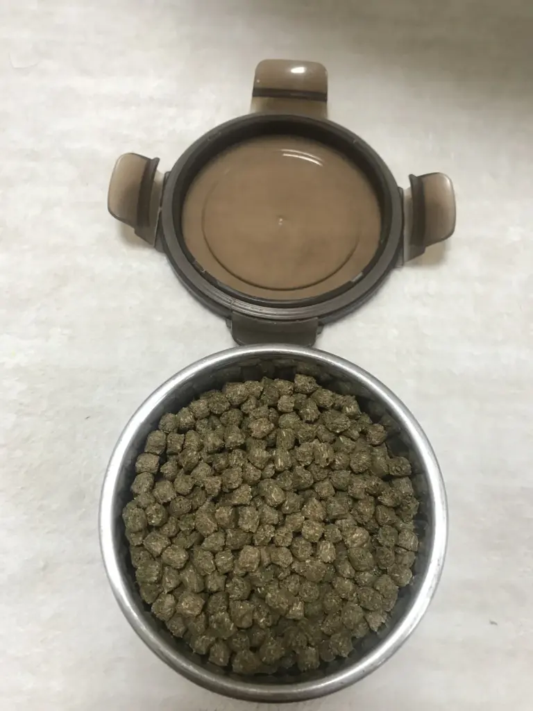 Genesis timothy pellets kept in a separate treat tin